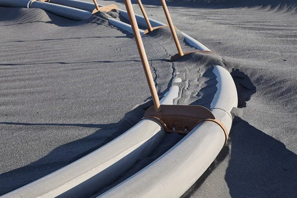 Pipes Lying Black Sand Iceland — Stock Photo, Image