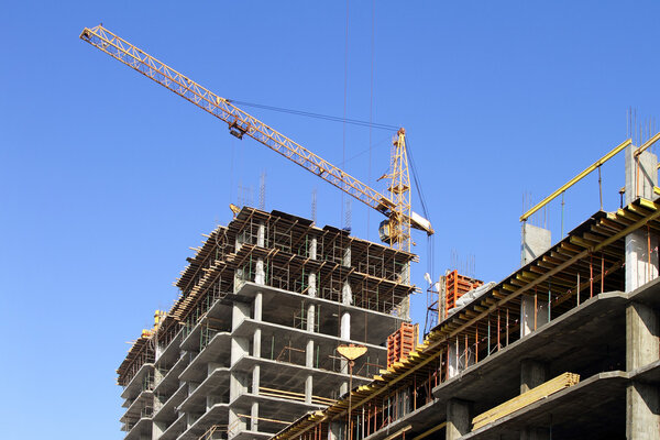 Building cranes and under construction building