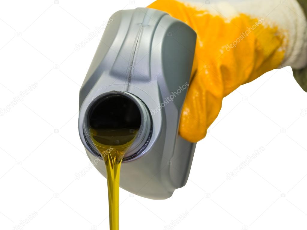 Synthetic motor oil pouring from a plastic canister