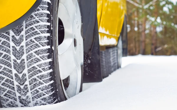 Winter tyres in snow — Stock Photo, Image