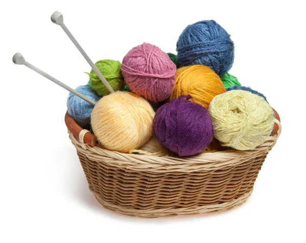 Knitting yarn balls and needles in basket — Stock Photo, Image