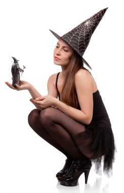 Beautiful girl in a cap of the witch clipart