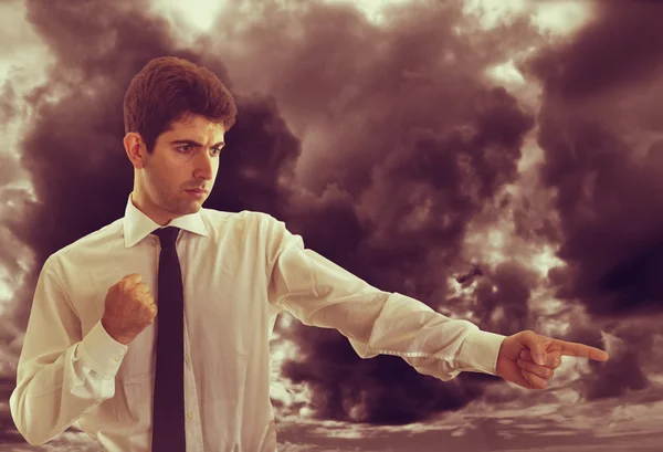 Angry Businessman with stormy clouds — Stock Photo, Image