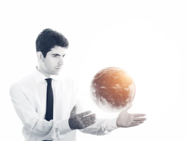 Empresário segurando um globo de terra brilhante — Fotografia de Stock
