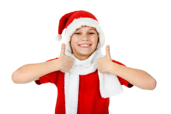 Szczęśliwy chłopiec w przedstawienie kciuki w górze, biały kapelusz Świętego Mikołaja — Zdjęcie stockowe