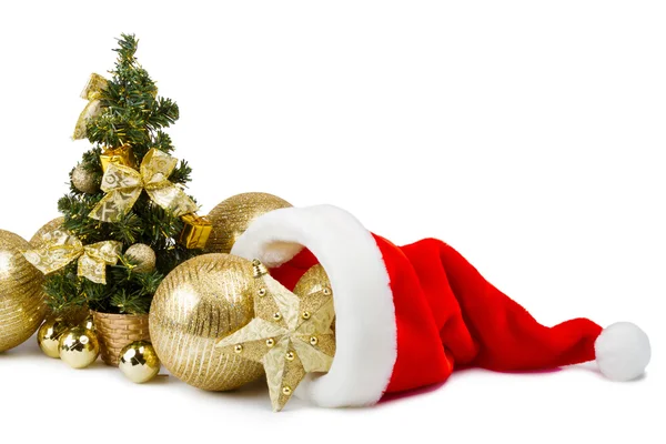 Palline d'oro a Babbo Natale cappello e albero di Natale — Foto Stock