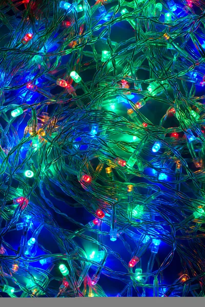 Multicolored electric christmas lights background. Decorative fe — Stock Photo, Image