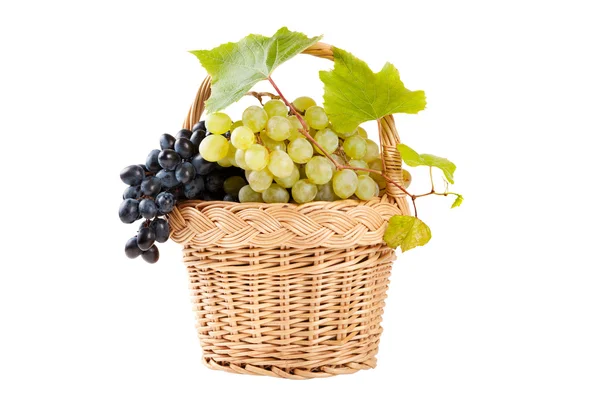 Grapes in basket with vine leaves isolated on white — Stock Photo, Image