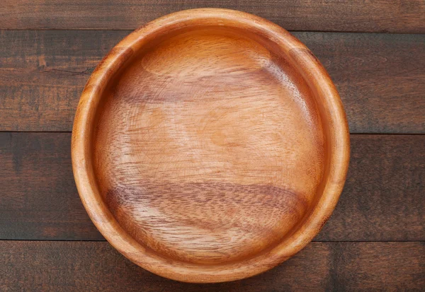 Empty Wooden Bowl on wooden table, top view — Stock Photo, Image