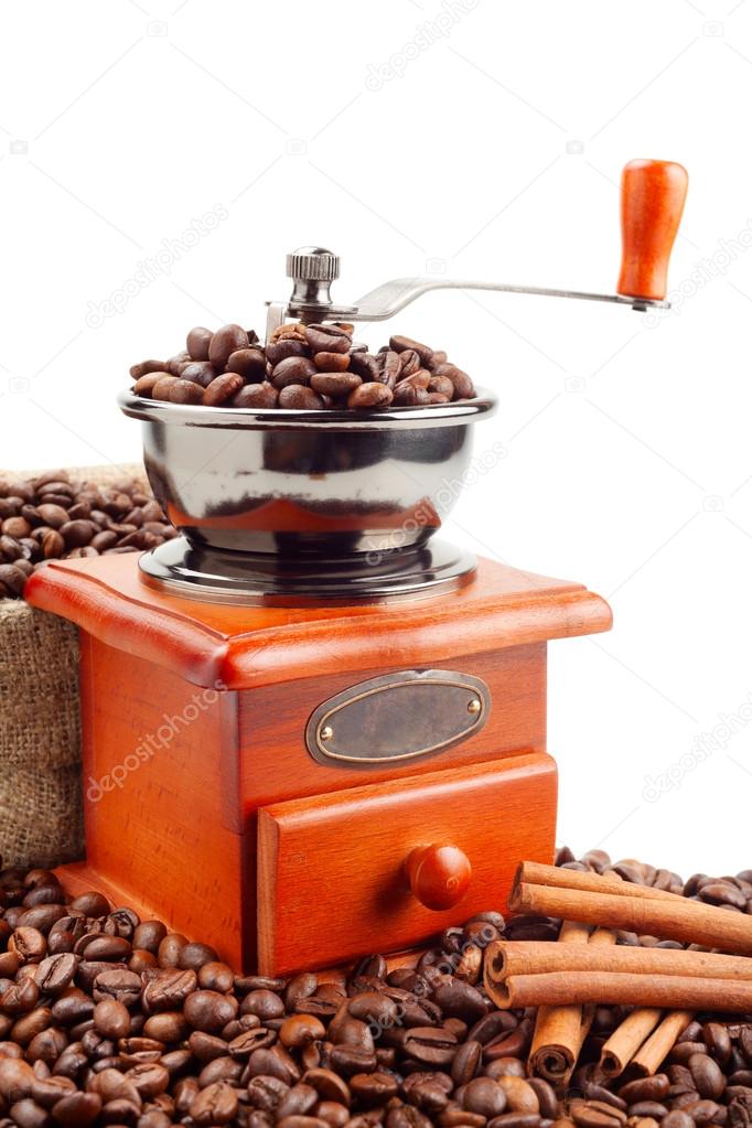 Coffee grinder with coffee beans and cinnamon