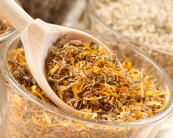 Healing herbs in wooden spoon closeup — Stock Photo, Image