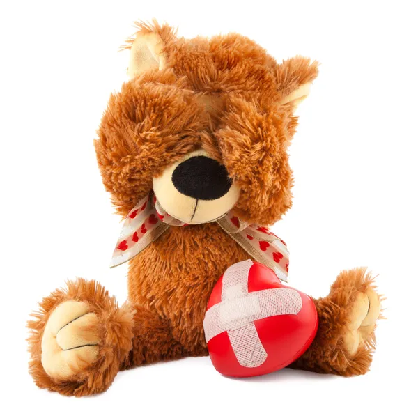 Teddy bear with red heart on white — Stock Photo, Image