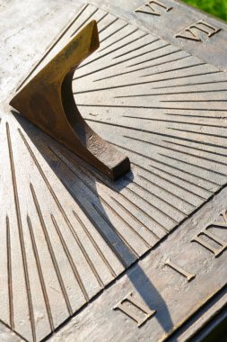 Closeup of bronze sundial clipart