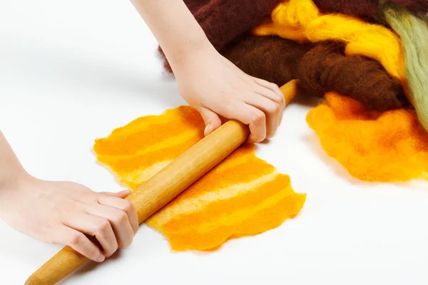 Woman hands with rolling pin making felt — Stock Photo, Image