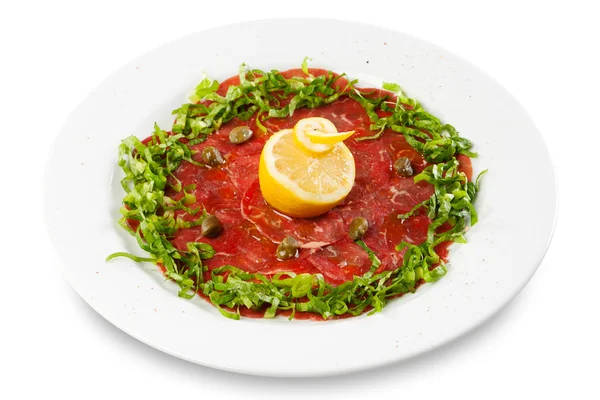 Beef Carpaccio with lemon and spring onion — Stock Photo, Image