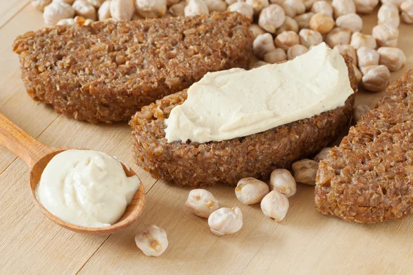 Bread slice with hummus dip — Stock Photo, Image