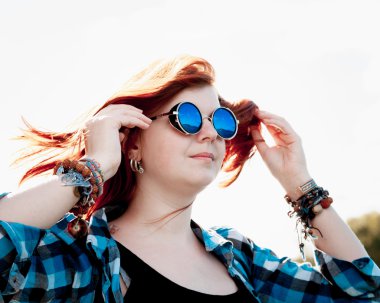 Beautiful young red hair woman sunglasses clipart