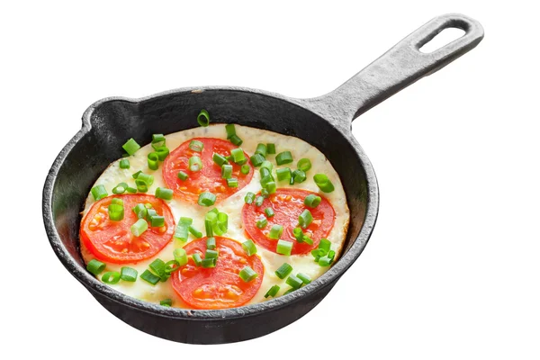 Frying pan with scrambled eggs and tomatoes — Stock Photo, Image