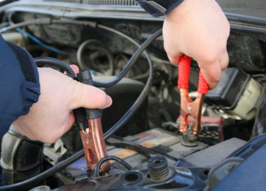 Mechanic charges the battery car clipart
