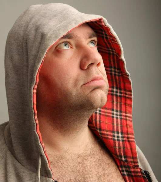 Close-up Portrait of adult thinking  man in the hood looking sid — Stock Photo, Image