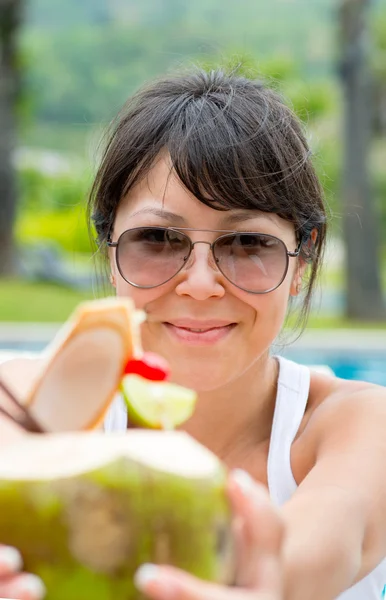 Close-up portrait young pretty woman drinking coconut cocktail — Stock Photo, Image