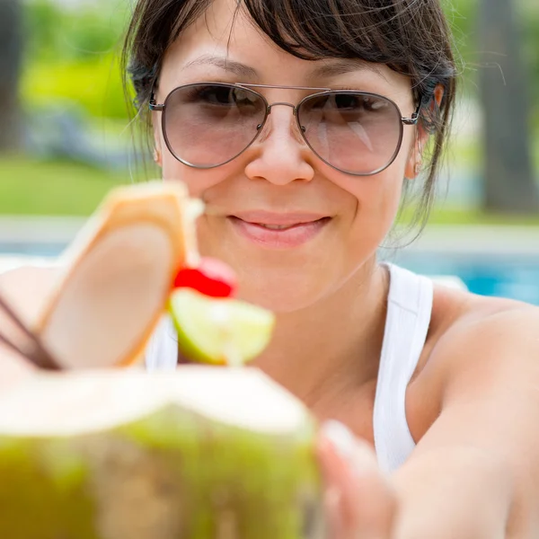 Close-up portrait young pretty woman drinking coconut cocktail — Stock Photo, Image