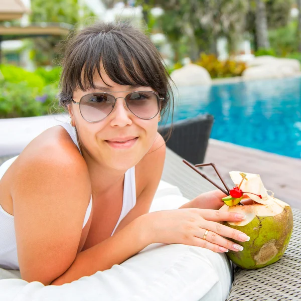 Close-up portrait young pretty woman drinking coconut cocktail — Stock Photo, Image