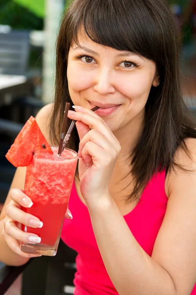Close-up portrait of young smiling woman with the juice — Stock Photo, Image