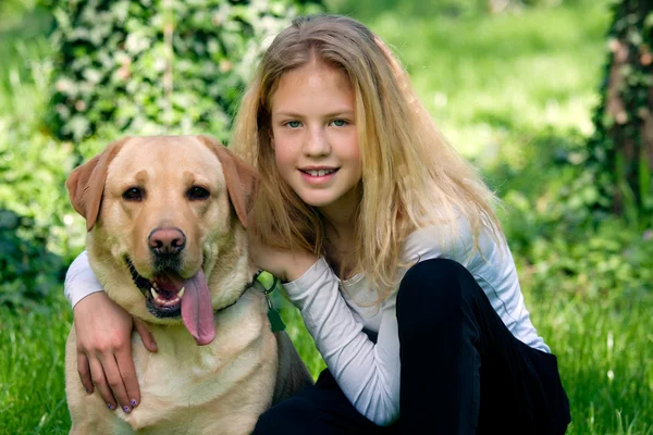 Young girl with a dog — Stock Photo, Image