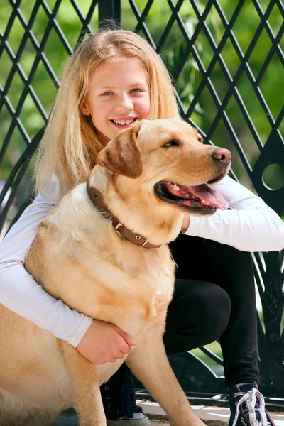Young girl with a dog — Stock Photo, Image