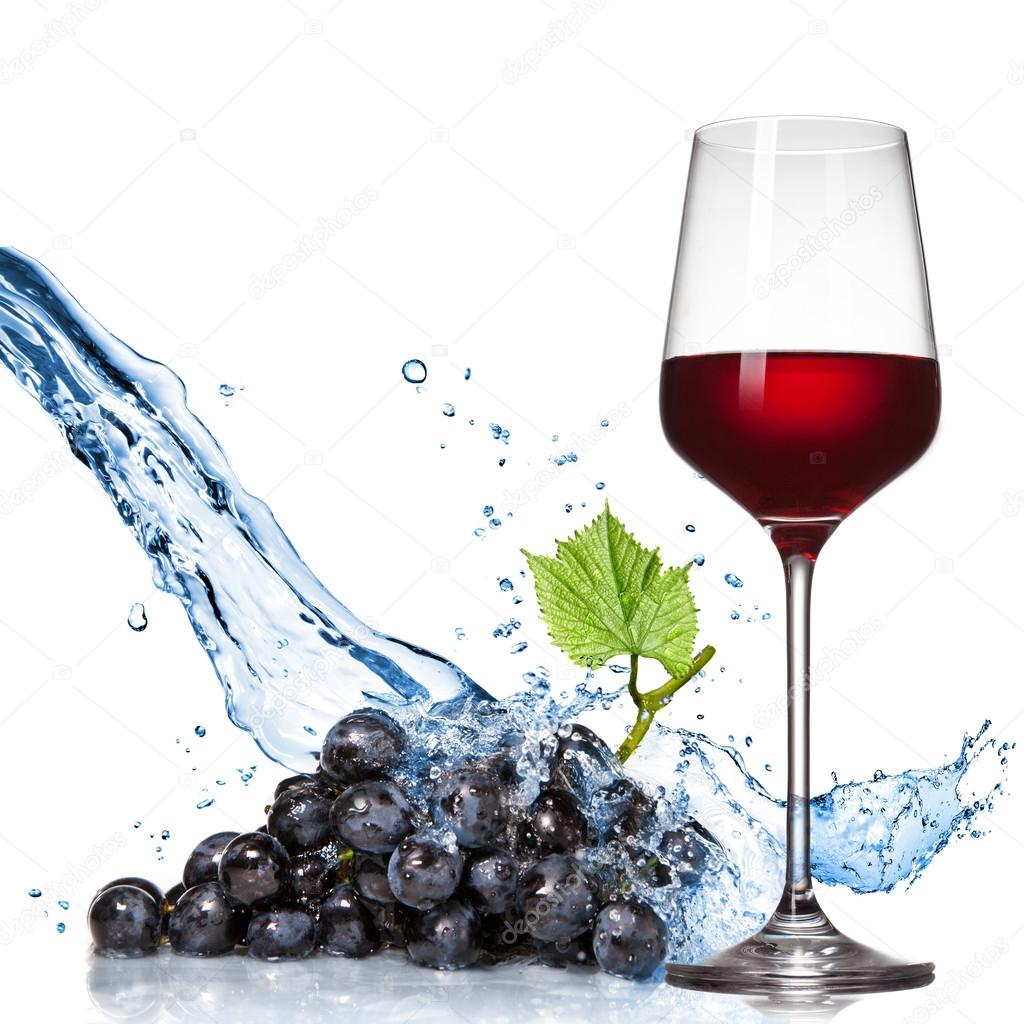 Glass of wine with blue grape and water splash isolated on white