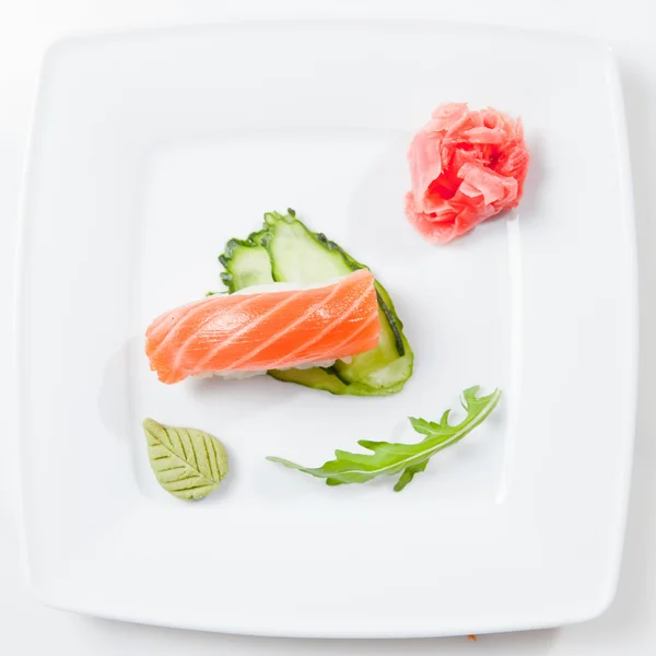 Sushi on plate isolated on white — Stock Photo, Image