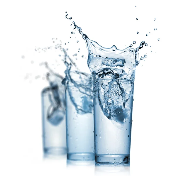 Water splash in glasses isolated on white — Stock Photo, Image