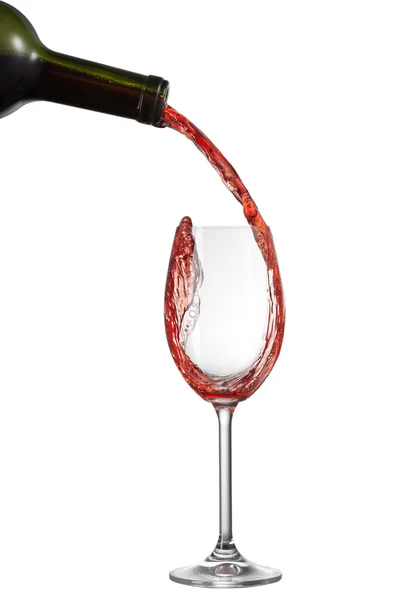 Red wine pouring into glass with splash isolated on white — Stock Photo, Image