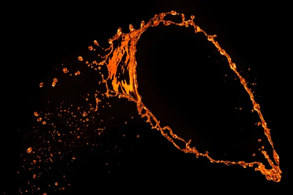 Spruzzata d'acqua arancione isolata sul nero — Foto Stock