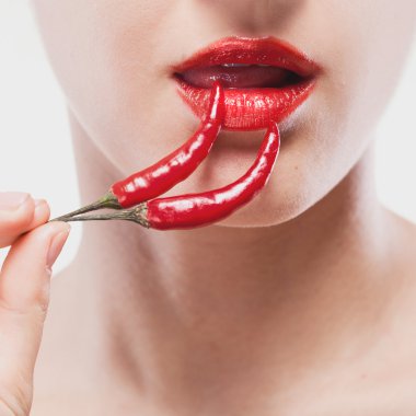 Young woman with chili pepper isolated on white clipart