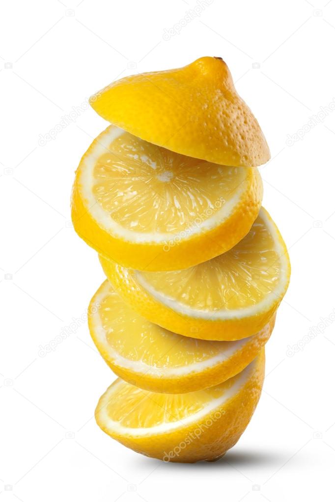 Falling slices of lemon isolated on white background