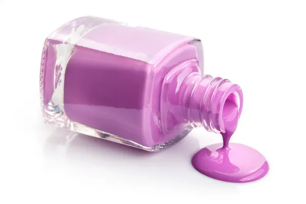 Esmalte de uñas rosa fluido aislado en blanco —  Fotos de Stock