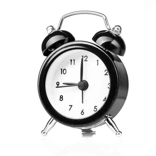 Relógio de alarme estilo antigo preto isolado no branco — Fotografia de Stock