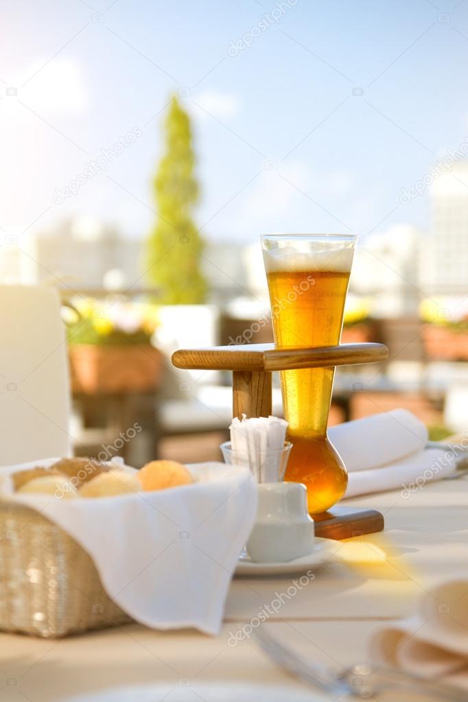 Kwak beer on the served table. Outdoors photo.