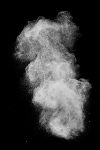 Вибух білого пороху ізольовано на чорному — стокове фото