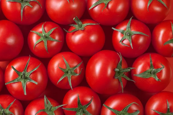 Red tomatoes background. top view — Stock Photo, Image