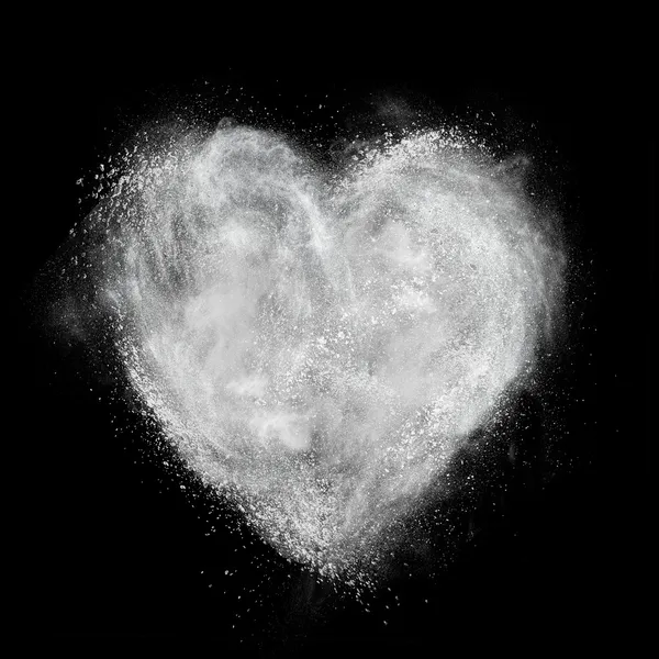 Heart made of white powder explosion isolated on black — Stock Photo, Image