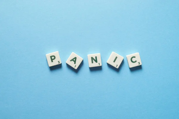 Panic Word Formed Messy Scrabble Tiles Blue Backdrop Anxiety Mental — Stockfoto