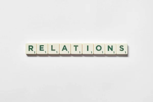 Relations Word Formed Scrabble Blocks White Background Simple Creative Backdrop — Stockfoto