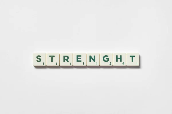 Strength Word Formed Scrabble Tiles White Background Simple Creative Backdrop — ストック写真