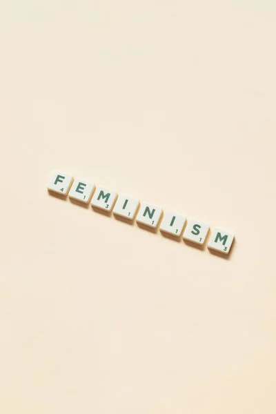 Word Feminism Formed Scrabble Blocks Beige Background Social Awareness Education — Stock Photo, Image