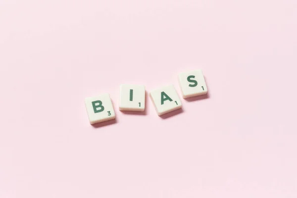 Bias Word Formed Scrabble Tiles Pink Background Creative Template Human — Stock Photo, Image