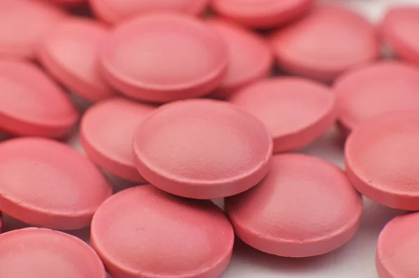 Scattering of pink tablets — Stock Photo, Image
