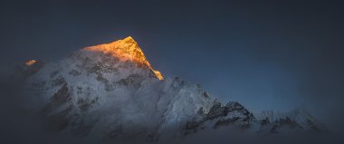 Himalya summits Everest and Nuptse at sunset clipart